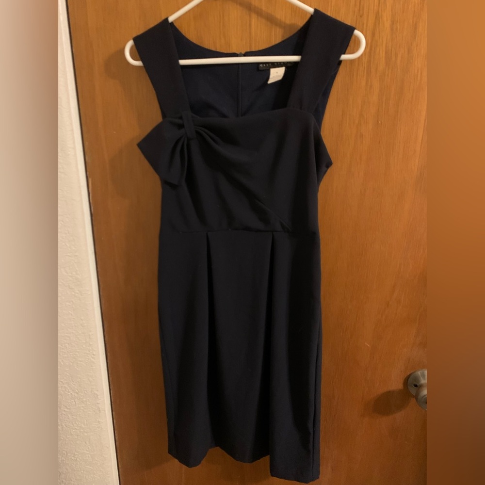 Navy pencil skirt dress with bow detail.